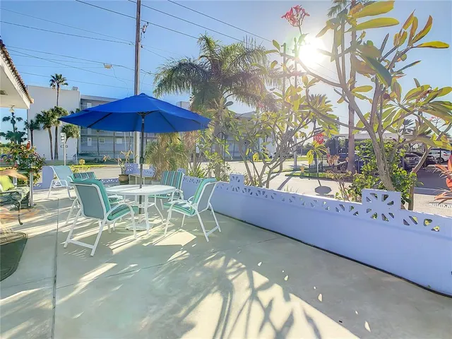 a living room with furniture and flowers