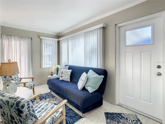 a living room with furniture and a window