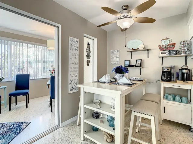 a kitchen with cabinets and stainless steel appliances
