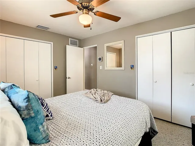 a bedroom with a bed and a dresser