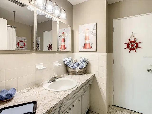 a view of a house with potted plants