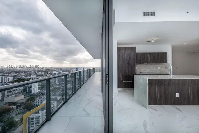 a view of a hallway with washer and dryer