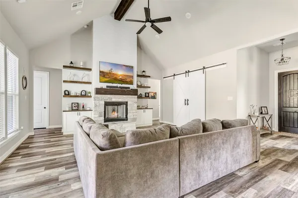 a living room with furniture and a large window