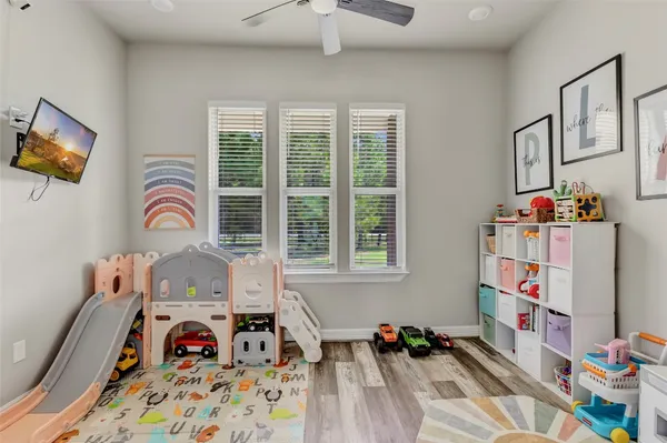 a view of a livingroom with furniture and toys