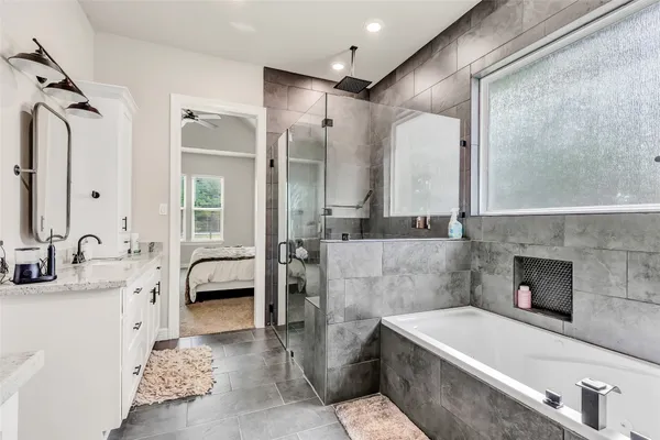 a view of walk in closet with clothes