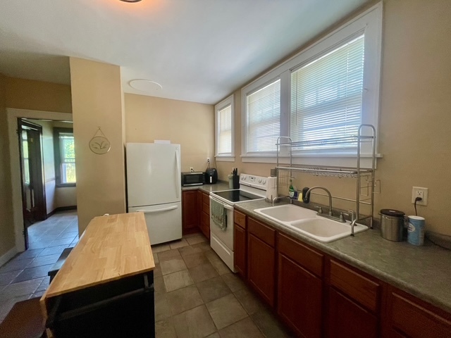 3369 East 2059th Road Wedron, IL 60557 - Photo 14 of 22 a kitchen with a sink and wooden cabinets