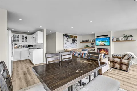 a kitchen with cabinets stainless steel appliances and a sink