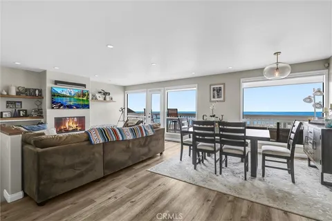 a living room with kitchen island furniture and a kitchen view