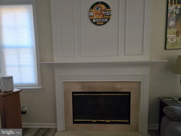 a fireplace with white wall