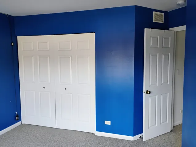 a view of an empty room with a door