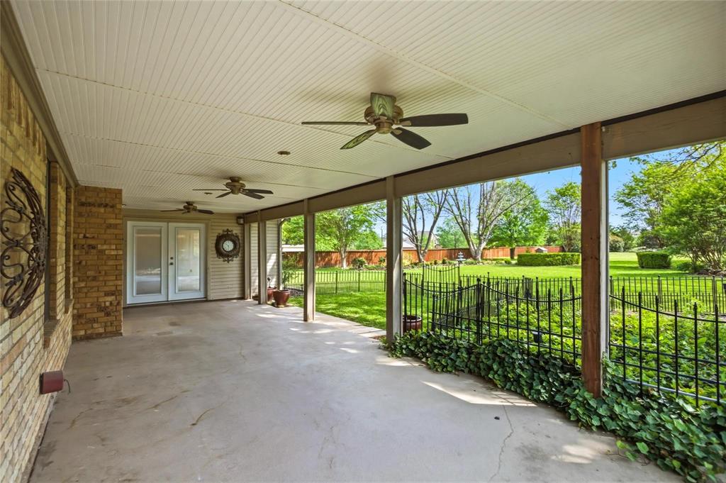 265 East Dove Road Southlake, TX 76092 - Photo 31 of 39 a view of a porch with floor to ceiling window and stairs