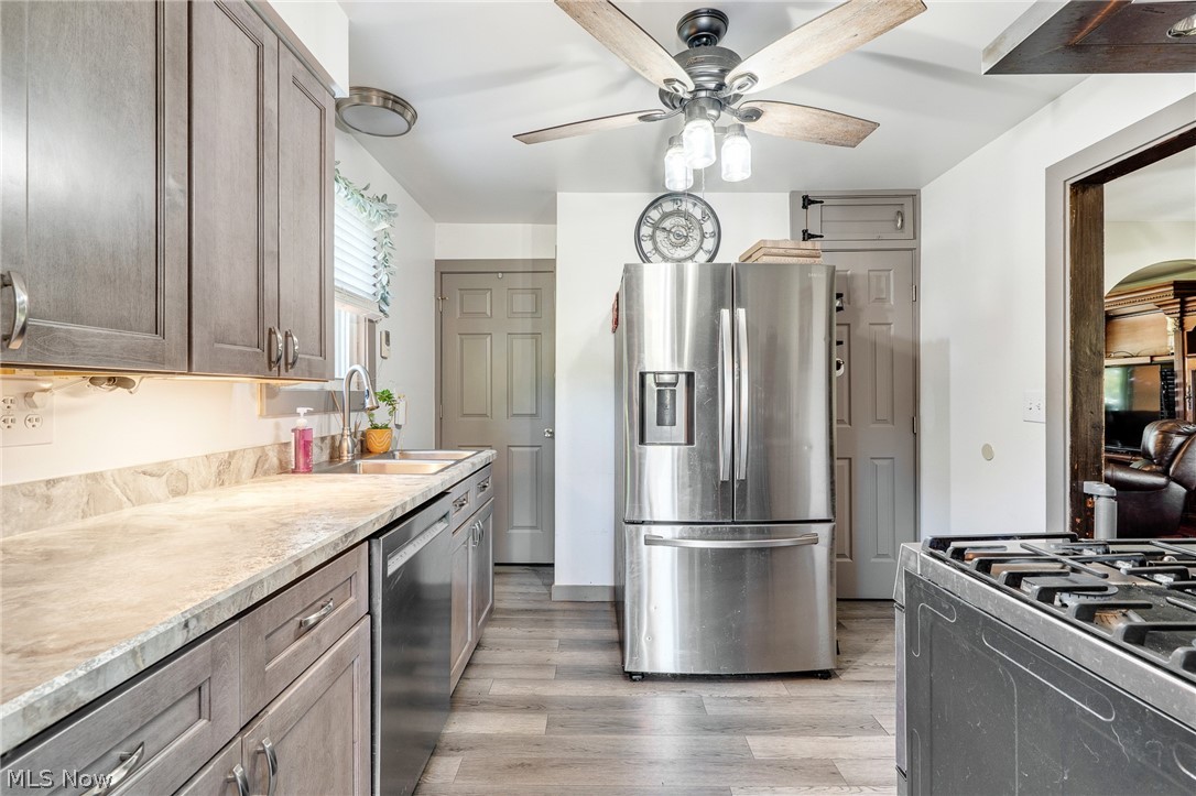5840 Poland Struthers Road Youngstown, OH 44514 - Photo 23 of 50 Chef's kitchen featuring stainless steel French-door refrigerator, gas cooktop with professional-grade range, and marble subway tile backsplash