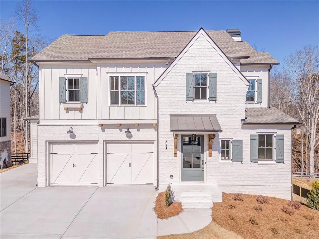 a front view of a house with white walls