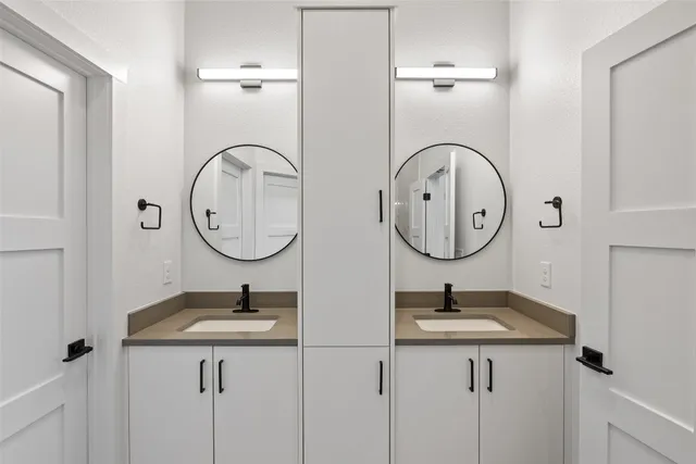 a bathroom with a sink and a mirror