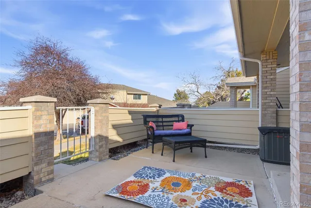 a view of a chairs and table in a patio