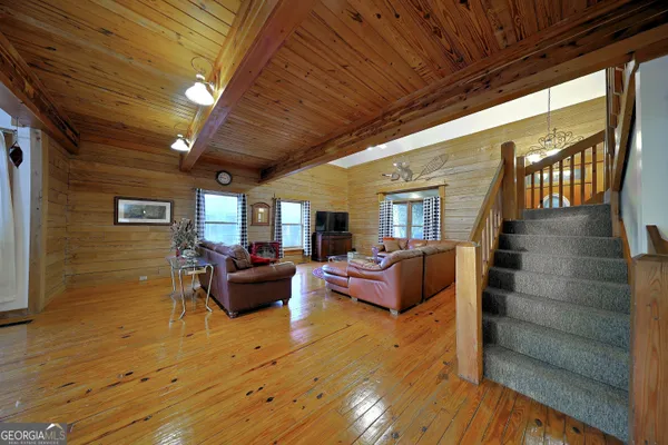 a bedroom with furniture and a window