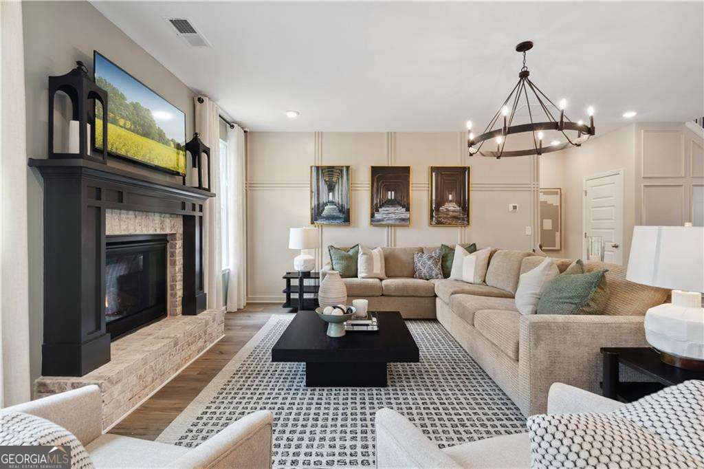 412 Hartsfield Road McDonough, GA 30253 - Photo 15 of 43 a living room with furniture and a fireplace