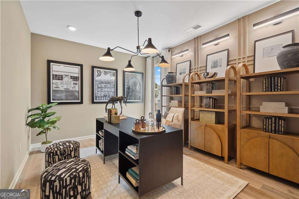 412 Hartsfield Road McDonough, GA 30253 - Photo 22 of 43 a living room with furniture flowerpot and wooden floor