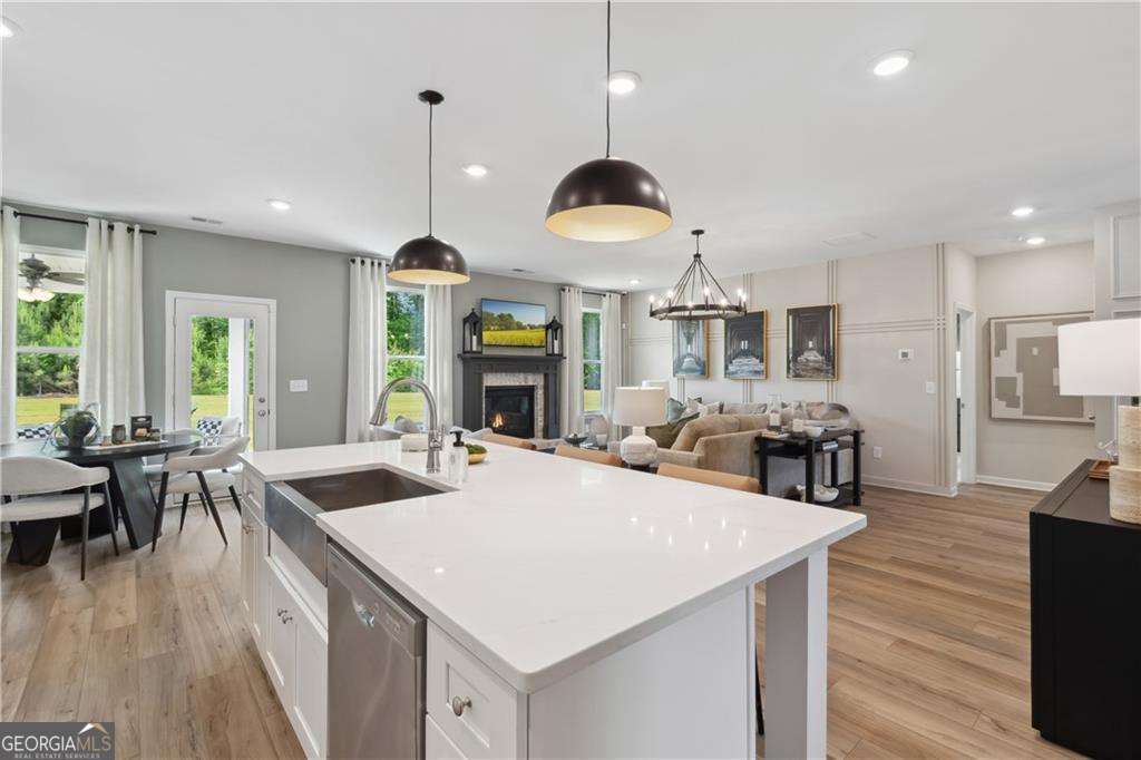 412 Hartsfield Road McDonough, GA 30253 - Photo 23 of 43 a large kitchen with a table and chairs