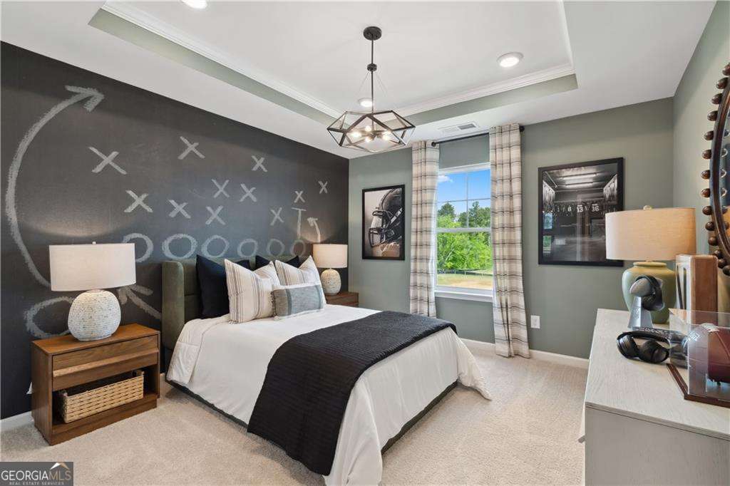 412 Hartsfield Road McDonough, GA 30253 - Photo 26 of 43 a bedroom with a bed ceiling fan and a window