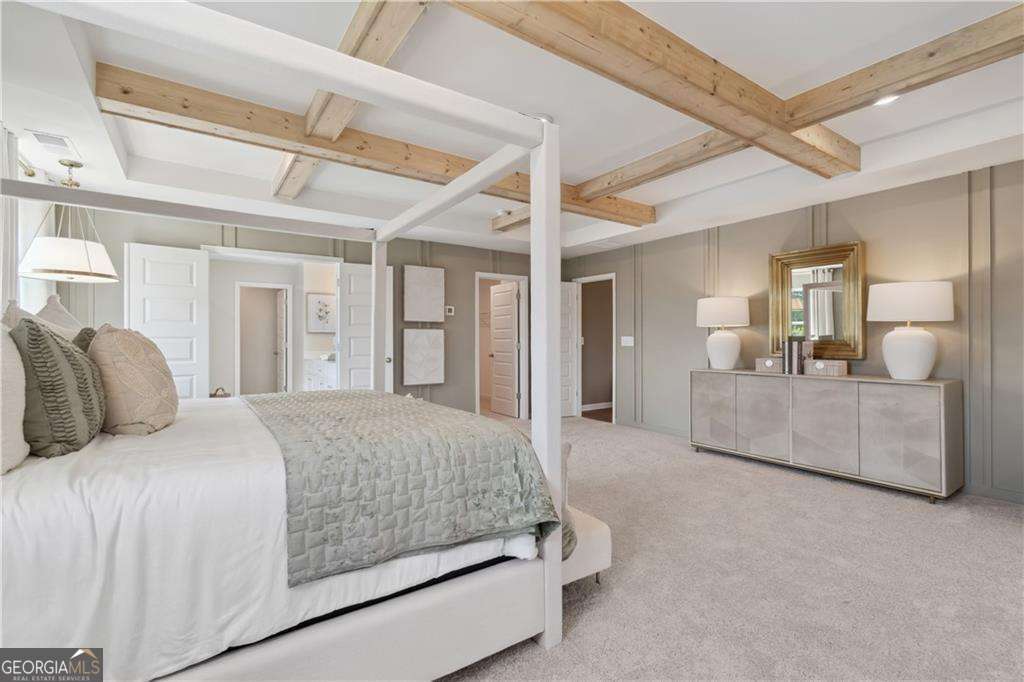 412 Hartsfield Road McDonough, GA 30253 - Photo 37 of 43 a bedroom with a large bed and a chandelier
