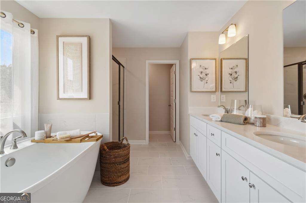 412 Hartsfield Road McDonough, GA 30253 - Photo 40 of 43 a bathroom with a double vanity sink mirror and bathtub
