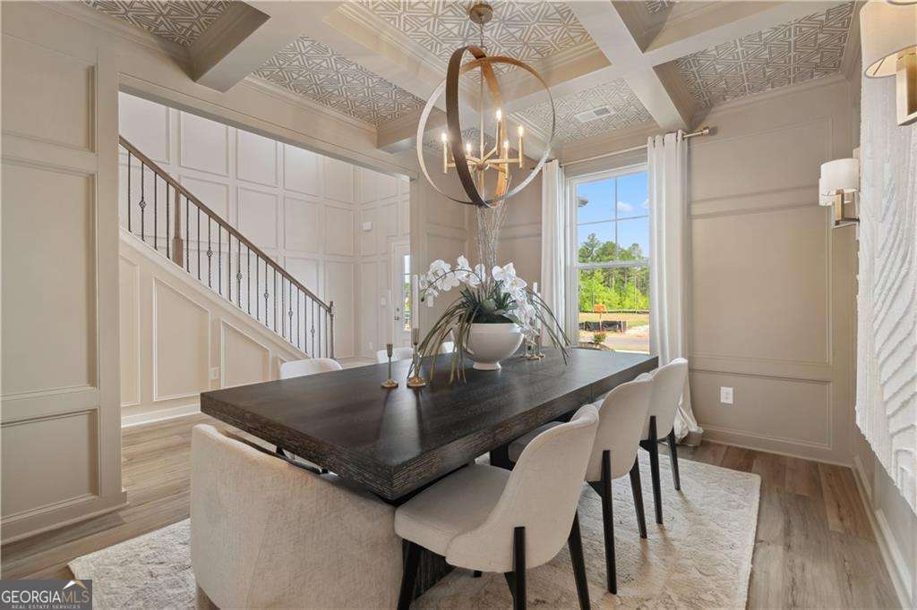 412 Hartsfield Road McDonough, GA 30253 - Photo 4 of 43 a view of a dining room with furniture and wooden floor