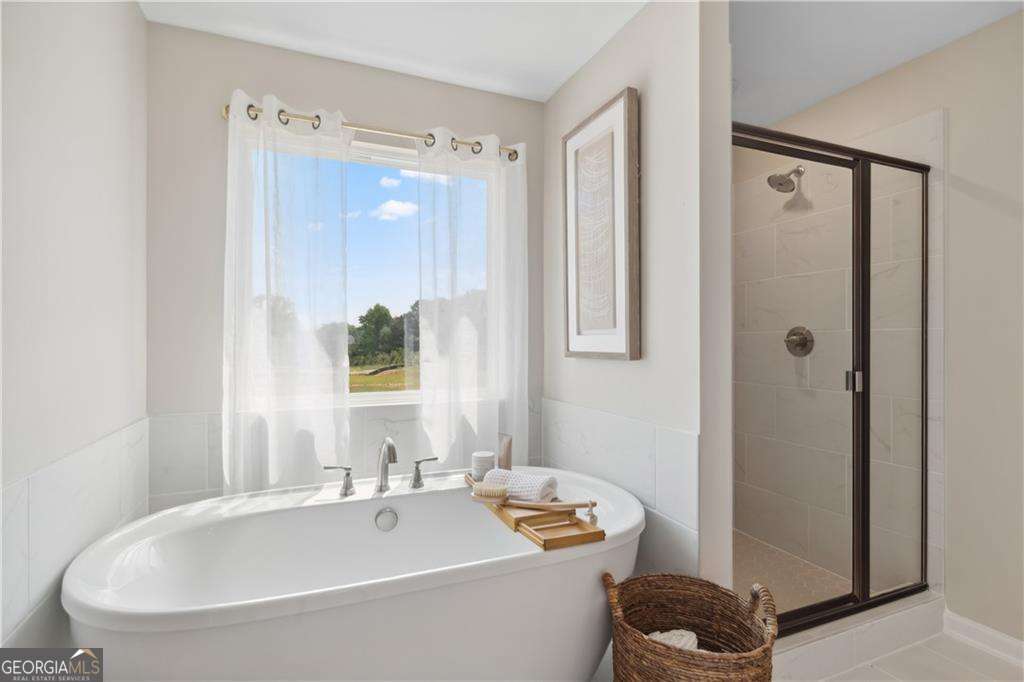412 Hartsfield Road McDonough, GA 30253 - Photo 42 of 43 a bathroom with a tub and a sink