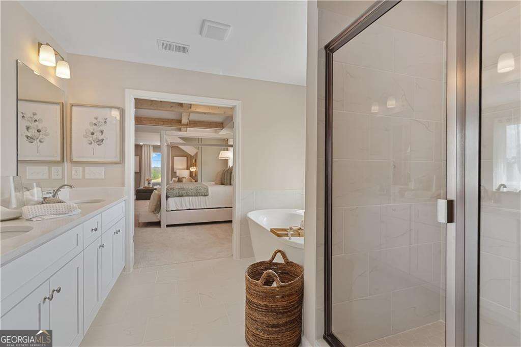 412 Hartsfield Road McDonough, GA 30253 - Photo 43 of 43 a en suite bathroom with a sink a toilet and shower