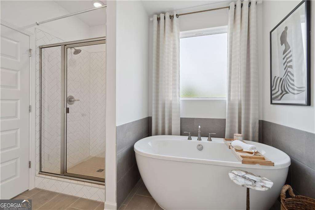 412 Hartsfield Road McDonough, GA 30253 - Photo 8 of 43 a white bath tub sitting next to a white sink