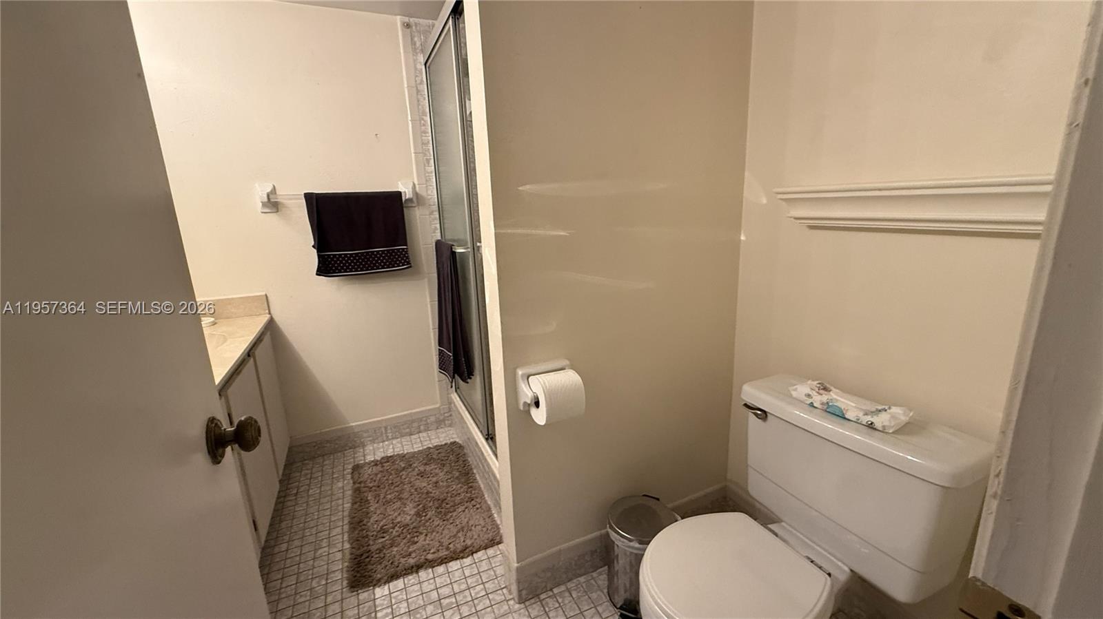 6800 Cypress Road, Unit 501 Plantation, FL 33317 - Photo 13 of 40 a bathroom with a toilet and a sink