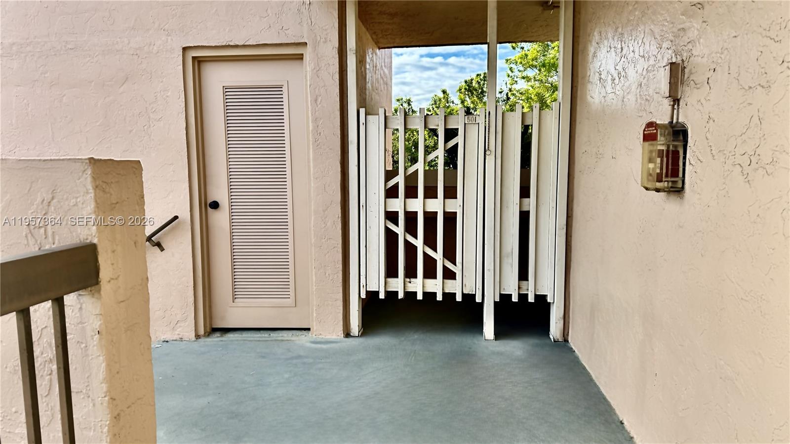 6800 Cypress Road, Unit 501 Plantation, FL 33317 - Photo 26 of 40 a view of a hallway with wooden floor and windows