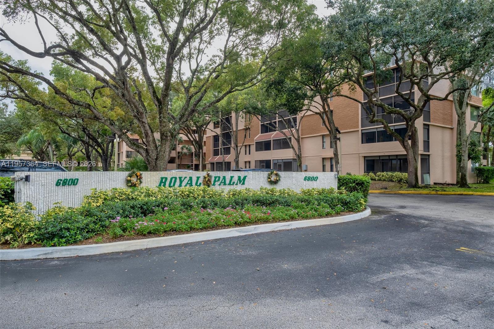 6800 Cypress Road, Unit 501 Plantation, FL 33317 - Photo 30 of 40 front view of a house with a garden