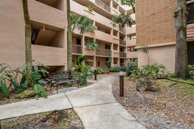 a view of a building with a yard