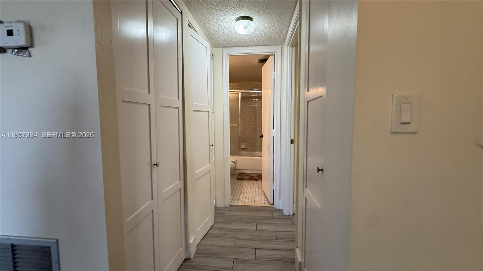 6800 Cypress Road, Unit 501 Plantation, FL 33317 - Photo 6 of 40 a view of a hallway with wooden floor