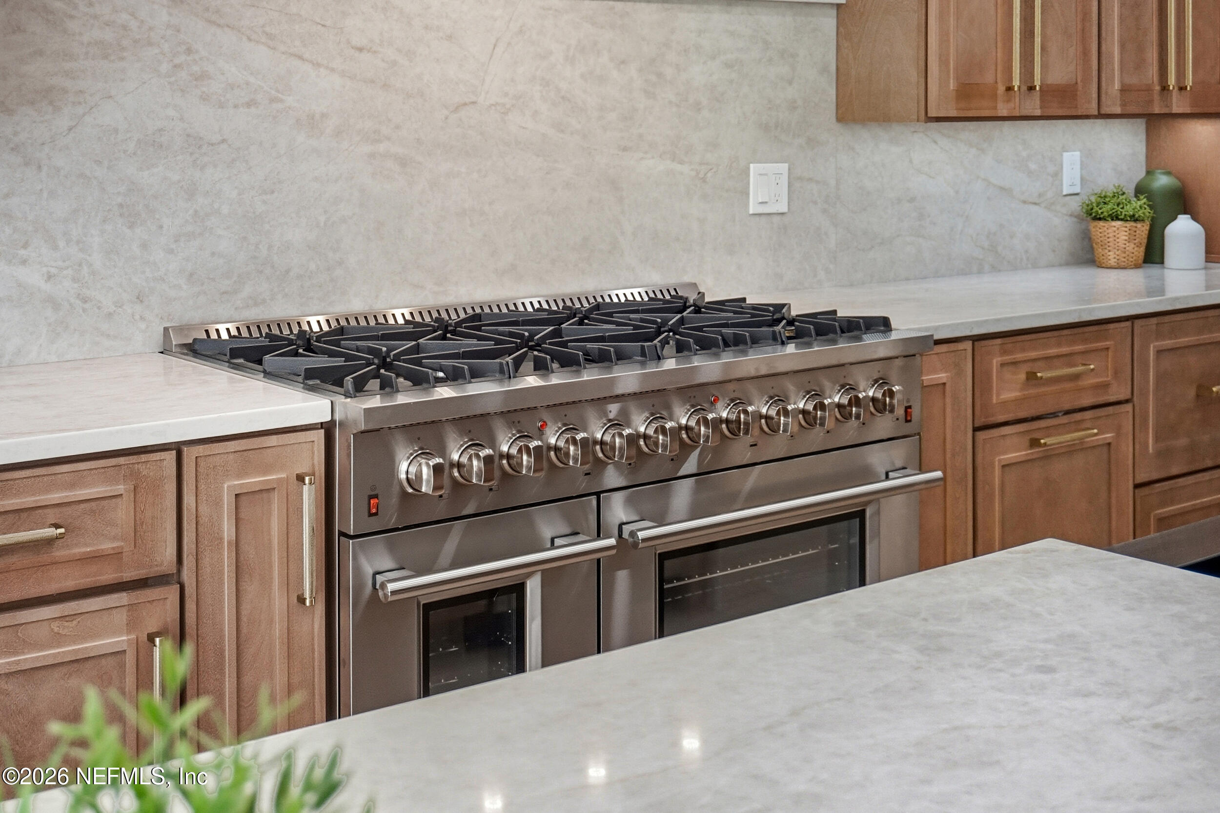 354 11th Street Atlantic Beach, FL 32233 - Photo 24 of 91 a kitchen with granite countertop stainless steel appliances and white cabinets