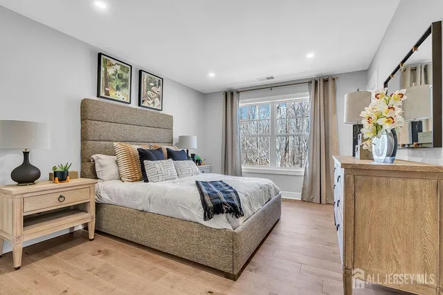 a bedroom with bed and window