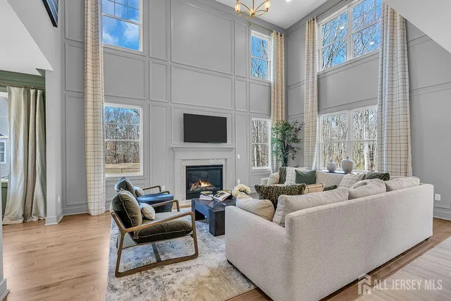a living room with furniture windows and a fireplace