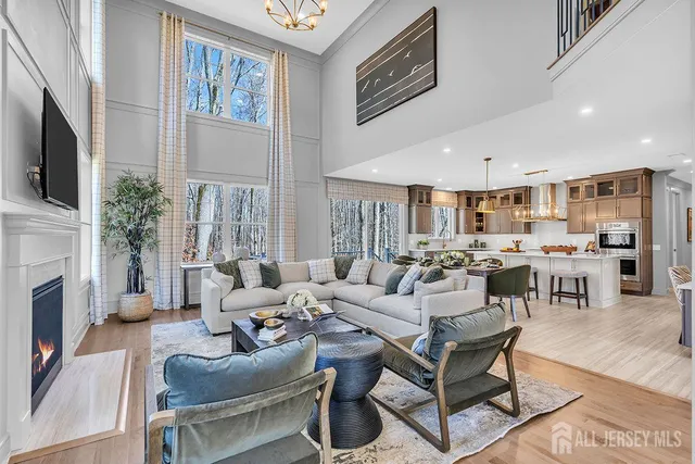 a living room with fireplace furniture and a flat screen tv