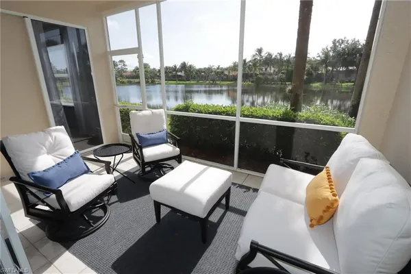 a view of a chairs and table in balcony
