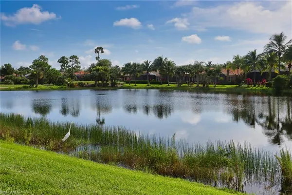 a view of a lake with a house in the background