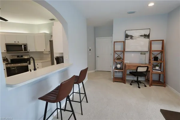 a view of a workspace with furniture