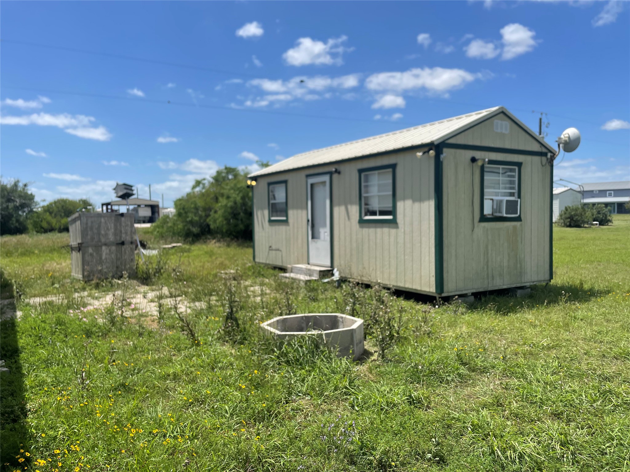 576 Ladyfish Road Palacios, TX 77465 - Photo 20 of 29 a backyard of a house with table and chairs