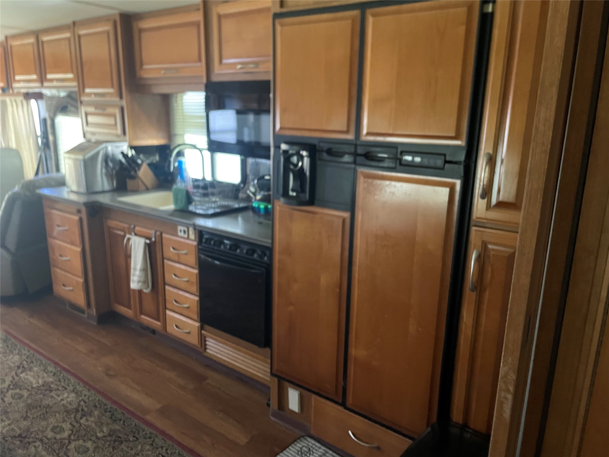 576 Ladyfish Road Palacios, TX 77465 - Photo 5 of 29 a kitchen with stainless steel appliances granite countertop a refrigerator a sink and a stove