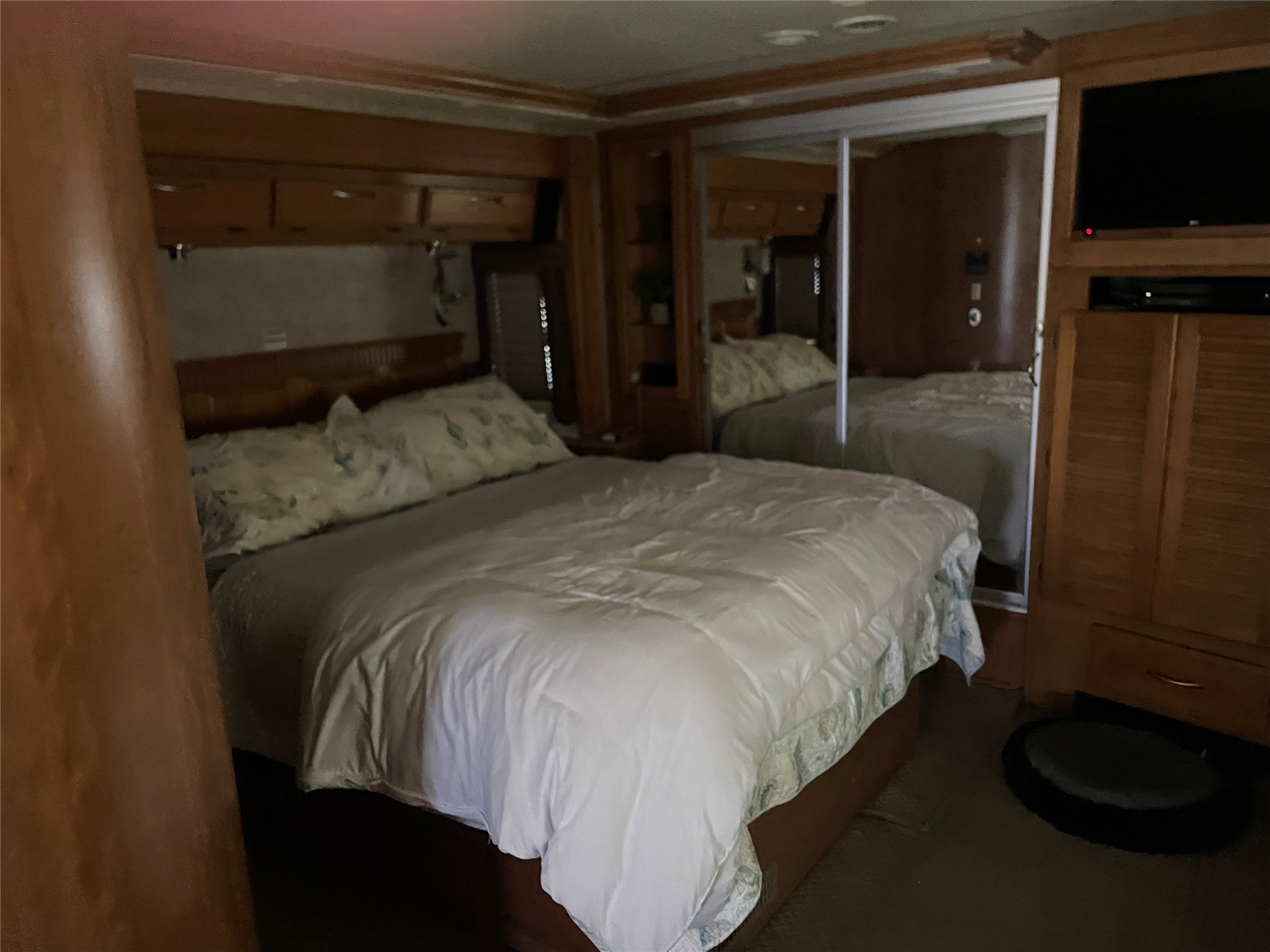 576 Ladyfish Road Palacios, TX 77465 - Photo 9 of 29 a bedroom with a bed and a tv on table