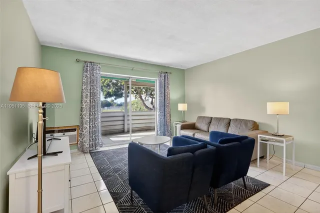 a living room with furniture and a window