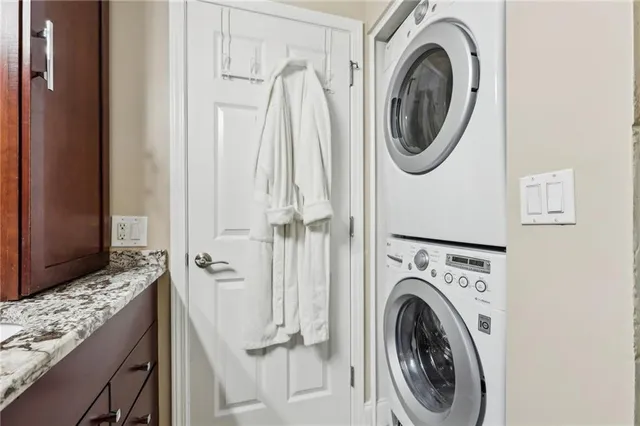 a bedroom with a bed and a chair