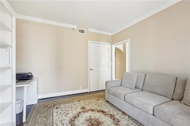 a view of a balcony with wooden floor and fence