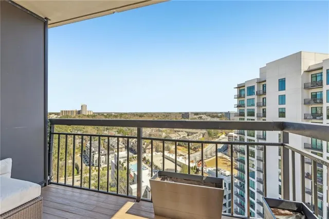 a view of a balcony with furniture