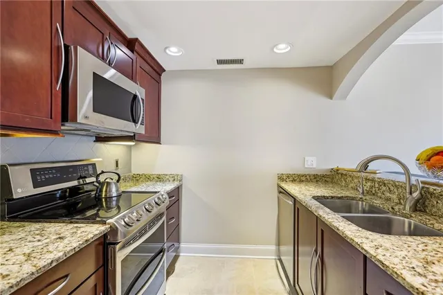 a kitchen with a stove and a sink
